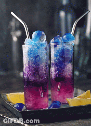 Two Glasses Of Blue And Purple Drinks With Straws GIF
