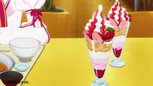 Two Glasses Of Ice Cream With Strawberries And Whipped Cream GIF