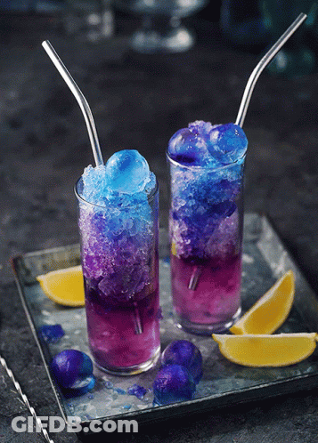 Two Glasses Of Purple And Blue Drinks With Straws GIF