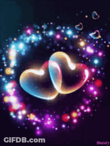 Two Glowing Hearts Are Surrounded By A Circle Of Lights GIF