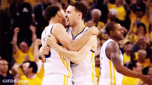 Two Golden State Warriors Basketball Players Are Hugging Each Other GIF