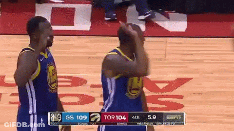 Two Golden State Warriors Players On The Court During A Game Against The Raptors GIF
