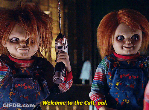 Two Good Guys Dolls Are Standing Next To Each Other Holding Guns And Saying Welcome To The Cult Pal GIF