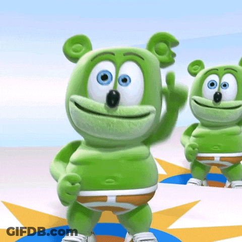 Two Green Gummy Bears Are Standing Next To Each Other Waving GIF
