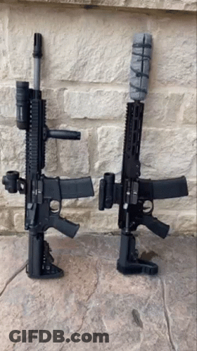 Two Guns Sitting On Stone Floor GIF