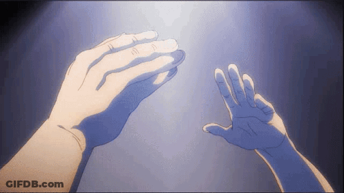 Two Hands Are Reaching Out Towards Each Other In The Dark GIF
