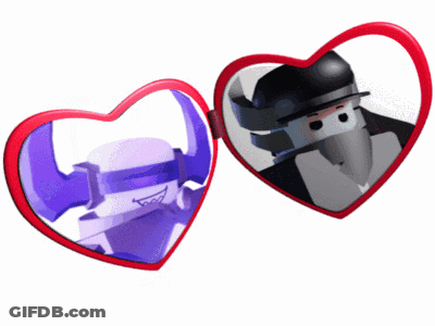 Two Heart Shaped Mirrors With A Picture Of A Man In A Hat GIF