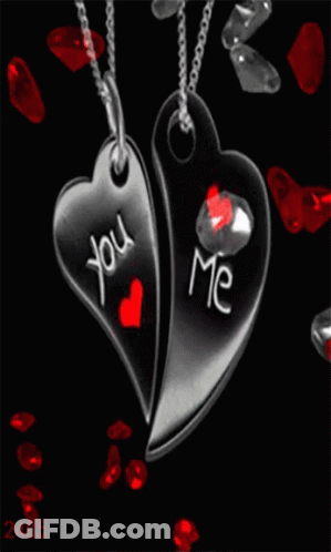 Two Heart Shaped Pendants With The Words You And Me Written On Them GIF