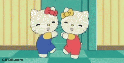 Two Hello Kitty Characters Dancing Together GIF
