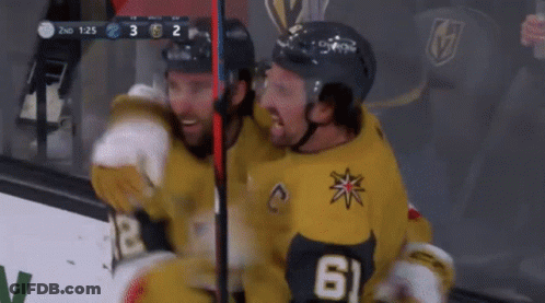 Two Hockey Players Are Hugging Each Other And One Has The Number 61 On His Jersey GIF