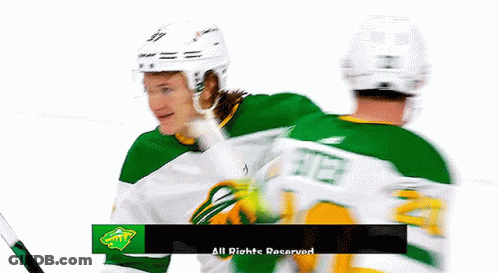 Two Hockey Players Are Standing Next To Each Other With The Words All Rights Reserved In The Upper Right Corner GIF