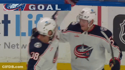 Two Hockey Players Celebrating Goal In Front Of Netw Ad GIF