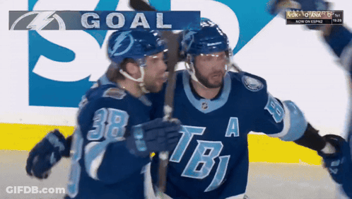 Two Hockey Players Celebrating Goal With TB Logo GIF