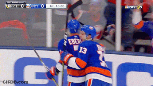 Two Hockey Players Hugging In Front Of Scoreboard Saying First Round Game 1 GIF