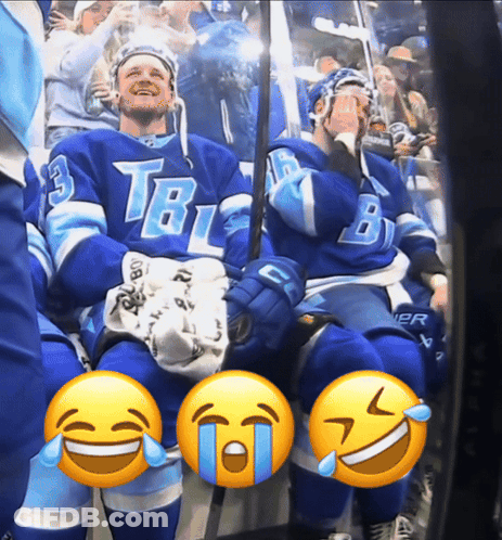 Two Hockey Players In TBL Jerseys Sitting In Stands GIF