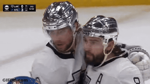 Two Hockey Players On Ice With TNT Scoreboard GIF