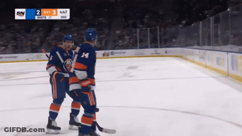 Two Hockey Players On The Ice With A Scoreboard That Says Sn On It GIF