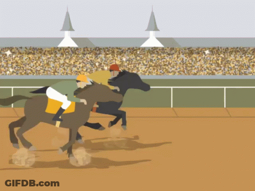 Two Horses Are Racing On A Dirt Track With A Crowd In The Background GIF