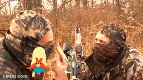 Two Hunters Talking With Cartoon Character GIF