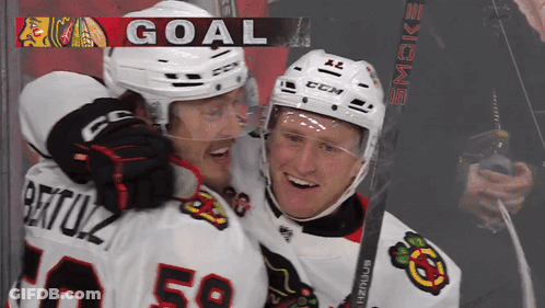 Two Ice Hockey Players Celebrate Goal GIF