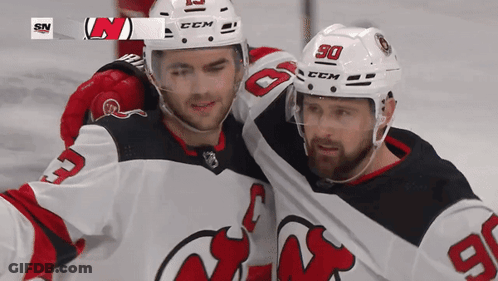 Two Ice Hockey Players Posing In CCM Helmets GIF