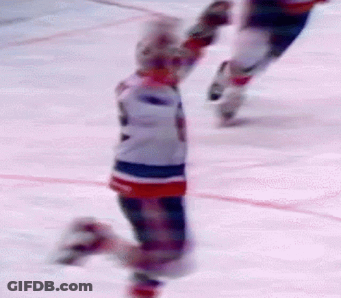 Two Ice Hockey Players Skating With Number 2 Jersey GIF