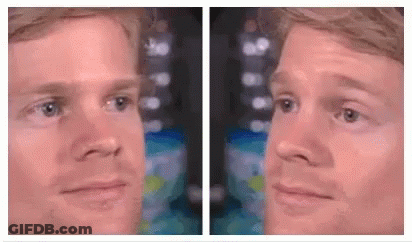 Two Images Of A Man 'S Face , One Of Which Is A Reflection Of Another Man 'S Face . GIF