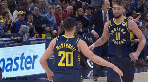 Two Indiana Pacers Players Standing On Court GIF