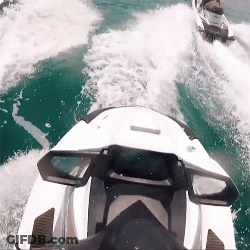 Two Jet Skis Are Going Through The Water And One Has The Word Yamaha On It GIF