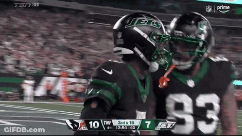 Two Jets Players Hugging On Field GIF