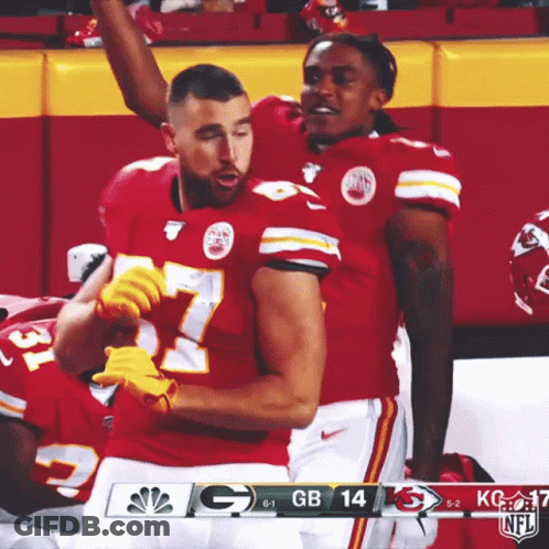 Two Kc Football Players Celebrate A Touchdown During A Game Against Gb GIF