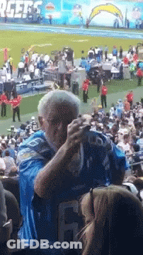 Two Kentucky Football Players Kissing GIF