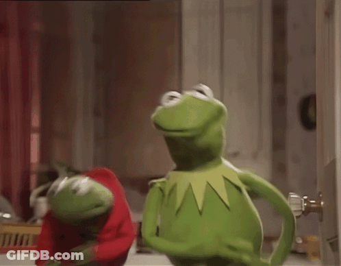 Two Kermit The Frogs Are Standing Next To Each Other And One Is Wearing A Red Sweater GIF