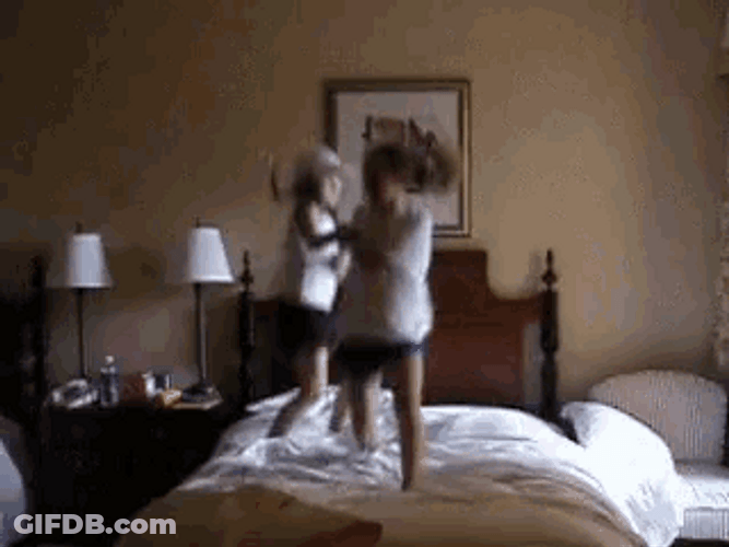 Two Kids Jumping On The Bed GIF