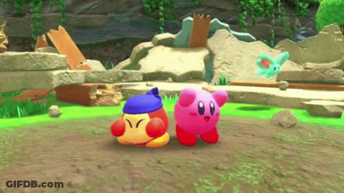 Two Kirbys Are Standing Next To Each Other In A Game GIF