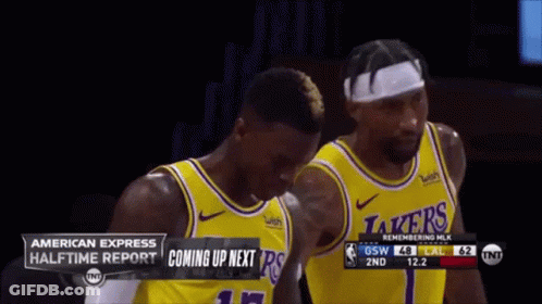 Two Lakers Basketball Players Are Standing Next To Each Other On The Court GIF