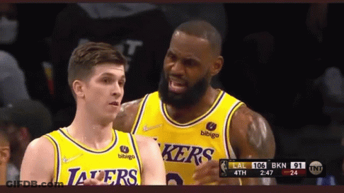 Two Lakers Basketball Players Standing GIF