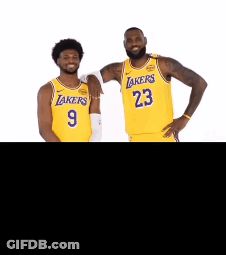 Two Lakers Players Are Posing For A Photo Together GIF