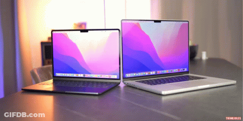 Two Laptops Are Sitting On A Table And One Of Them Says Thinkfiles GIF