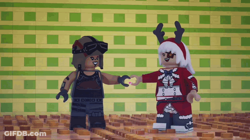 Two Lego Figures Are Standing Next To Each Other And One Is Wearing A Reindeer Hat GIF