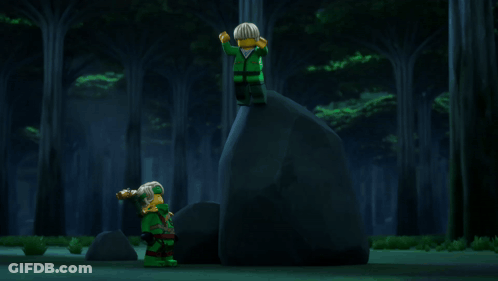 Two Lego Figures Hugging With Torch In Background GIF