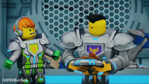 Two Lego Figures One With Bull Shield GIF