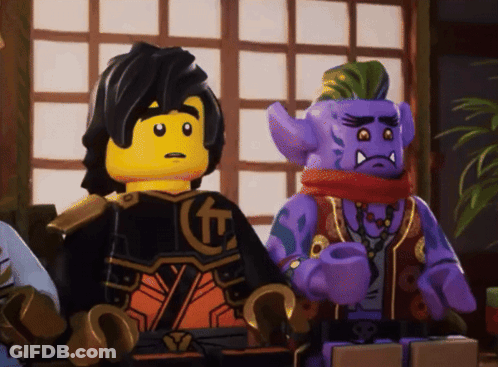 Two Lego Figures Sitting Next To Each Other GIF