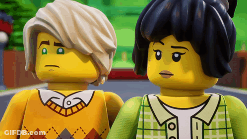 Two Lego Figures Standing Together GIF