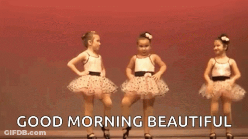 Two Little Girls Are Dancing Together On A Stage And The Words `` Good Morning Beautiful '' Are Above Them . GIF