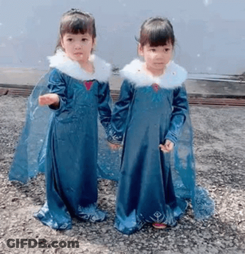 Two Little Girls In Blue Dresses Holding Hands GIF