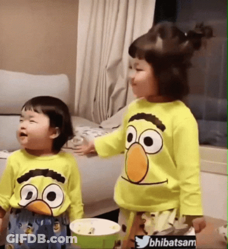Two Little Girls In Sesame Street Shirts GIF