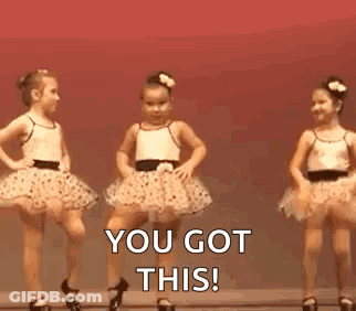 Two Little Girls In Tutus Are Dancing On A Stage . GIF