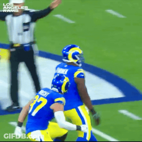 Two Los Angeles Rams Players With Referee GIF