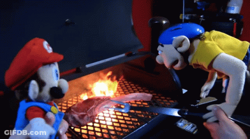 Two Mario Dolls Are Cooking On A Grill GIF